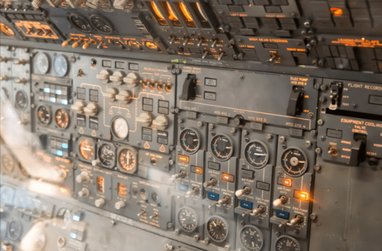 A wall panel full of airplane controls. 
